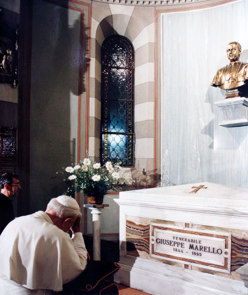 Bl. John Paul II prays at the tomb of St. Joseph Marello in Asti, Italy.